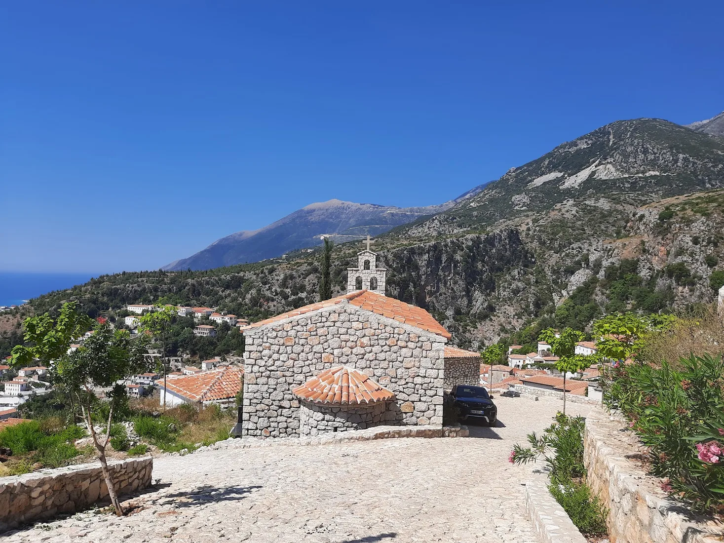 Panagia Drymadon basilica on the hilltop above Dhermi