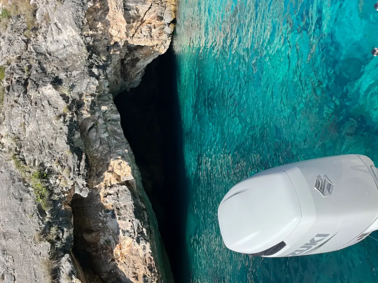 Aerial view of turquoise water at a small cove beach along the Albanian Riviera trail