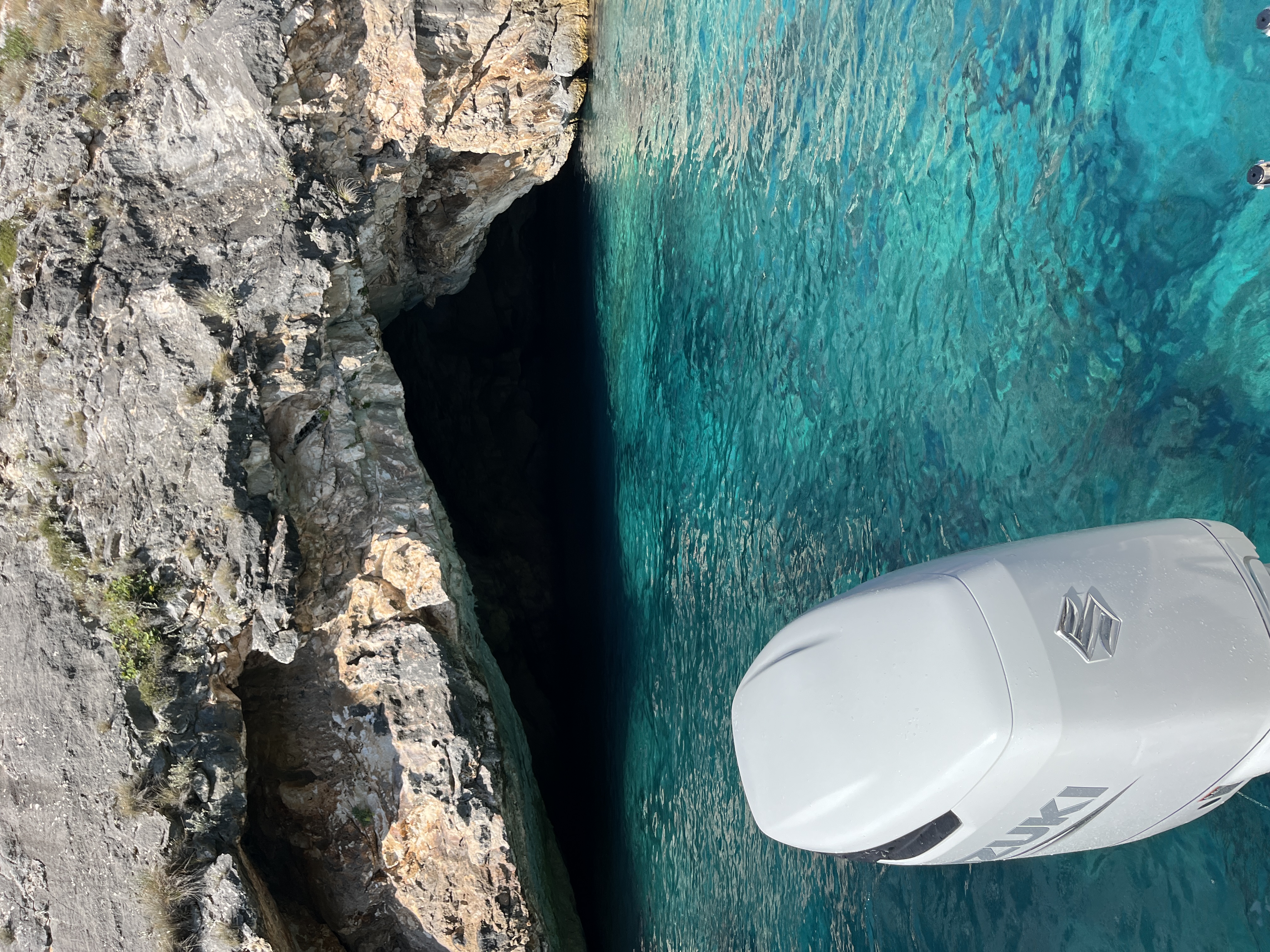 Aerial view of turquoise water at a small cove beach along the Albanian Riviera trail