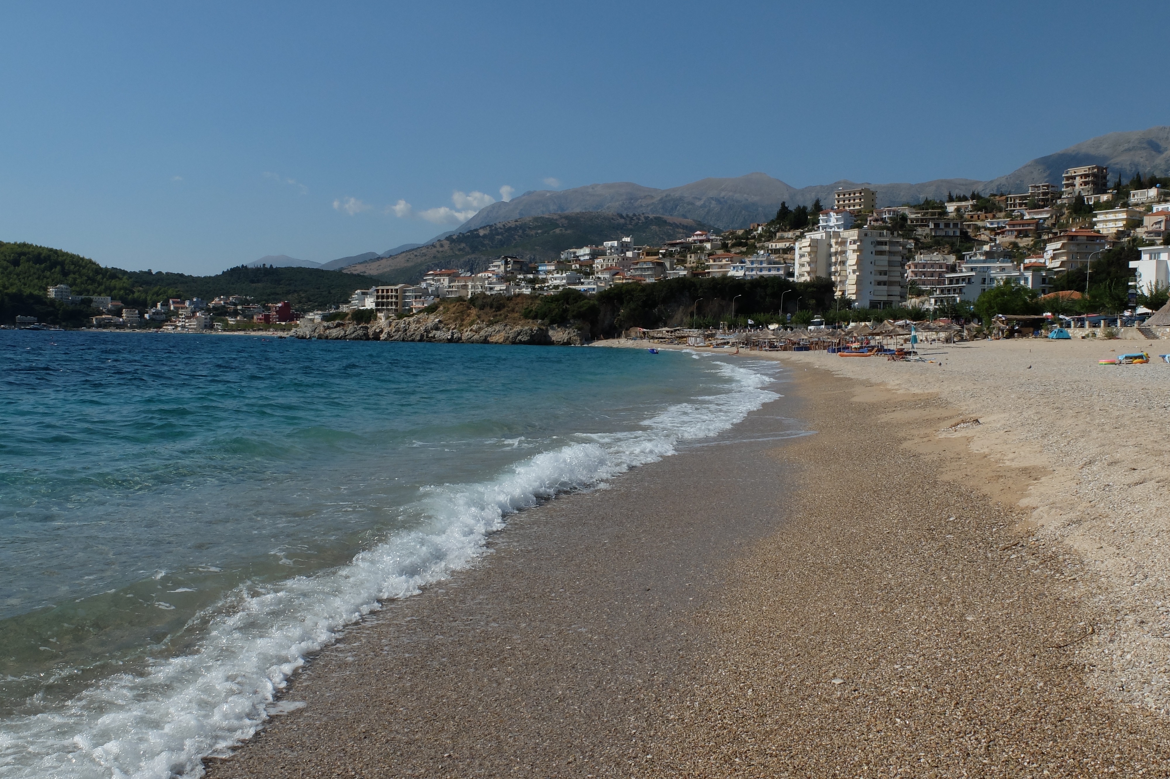 Wide Himara coastal view representing travel connectivity on the Riviera