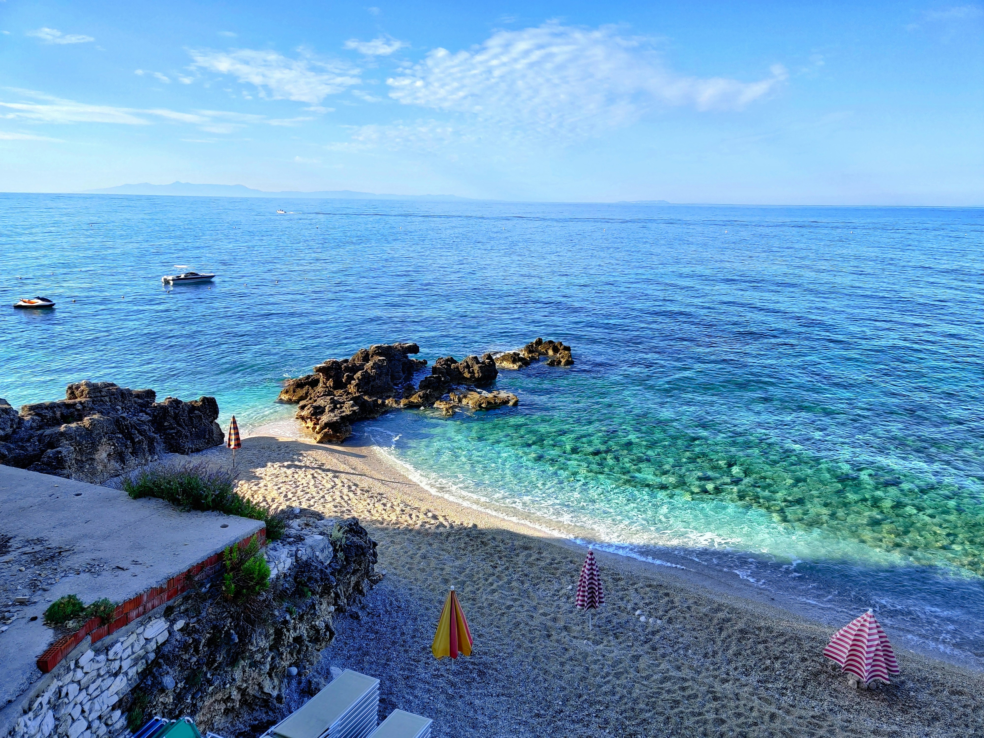 White pebble beach and blue water at Dhermi on the Albanian Riviera