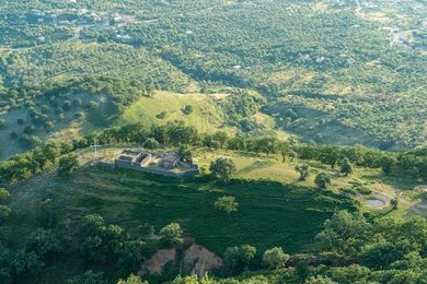 Aerial view of the Himara coastline with turquoise water and mountains