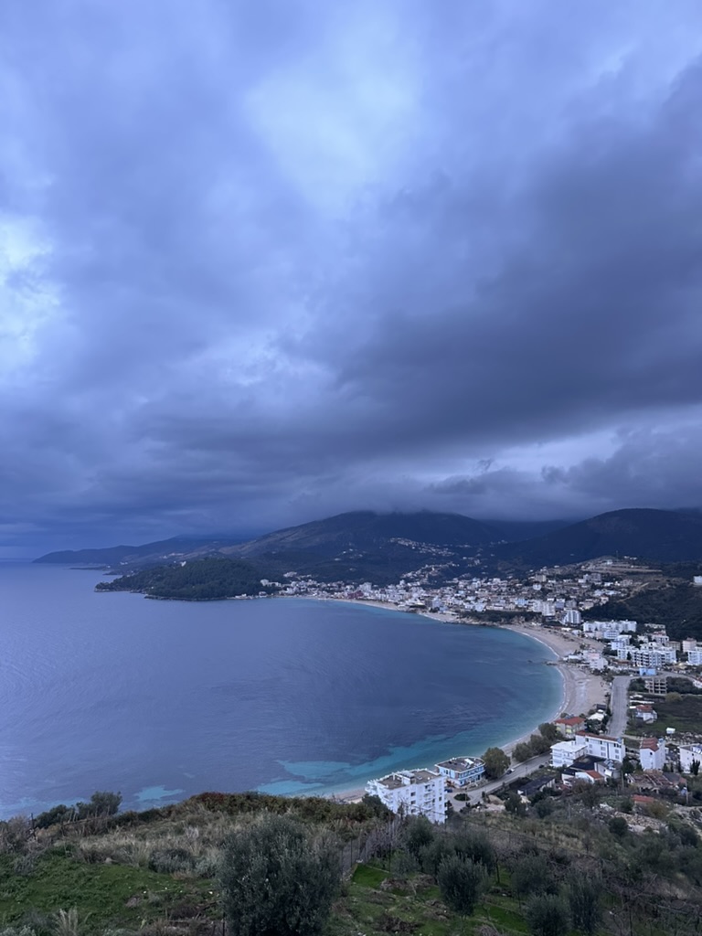 Autumn coastal view of the Himara shoreline in October's warm evening light