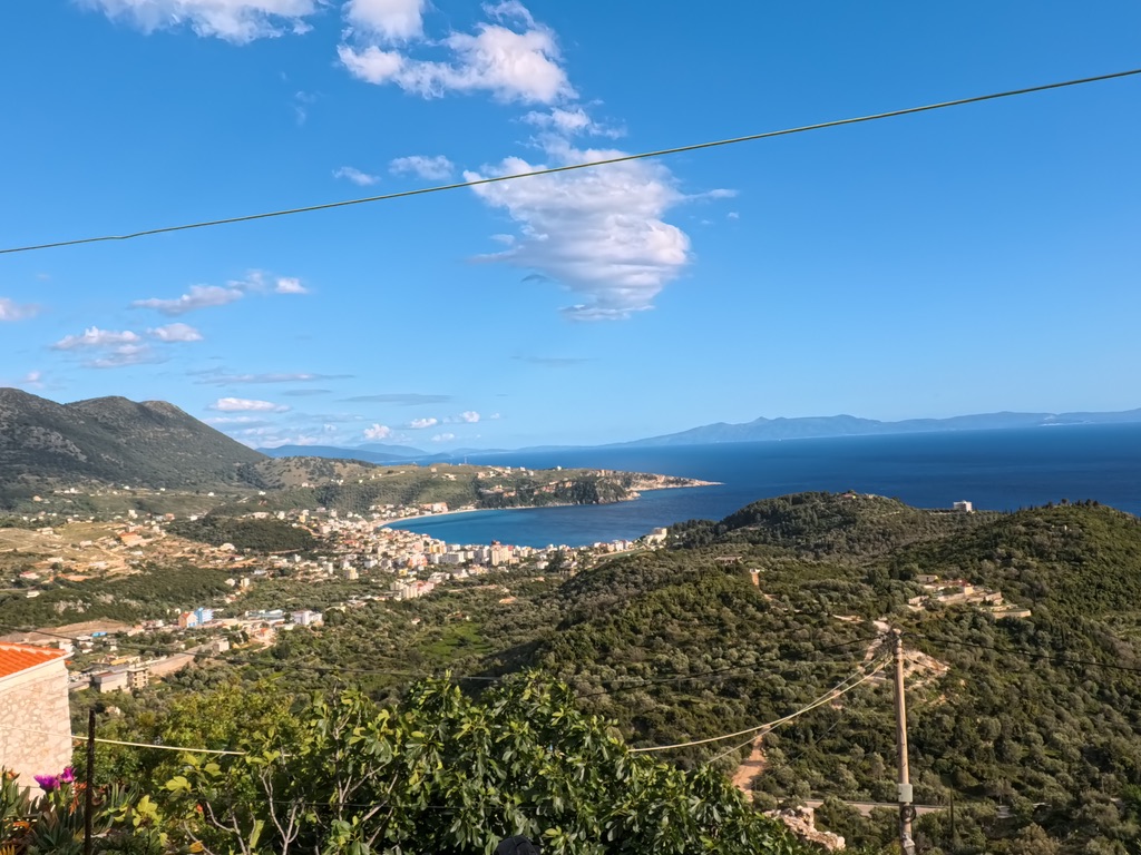 Himara old town view at golden hour along the coastal promenade