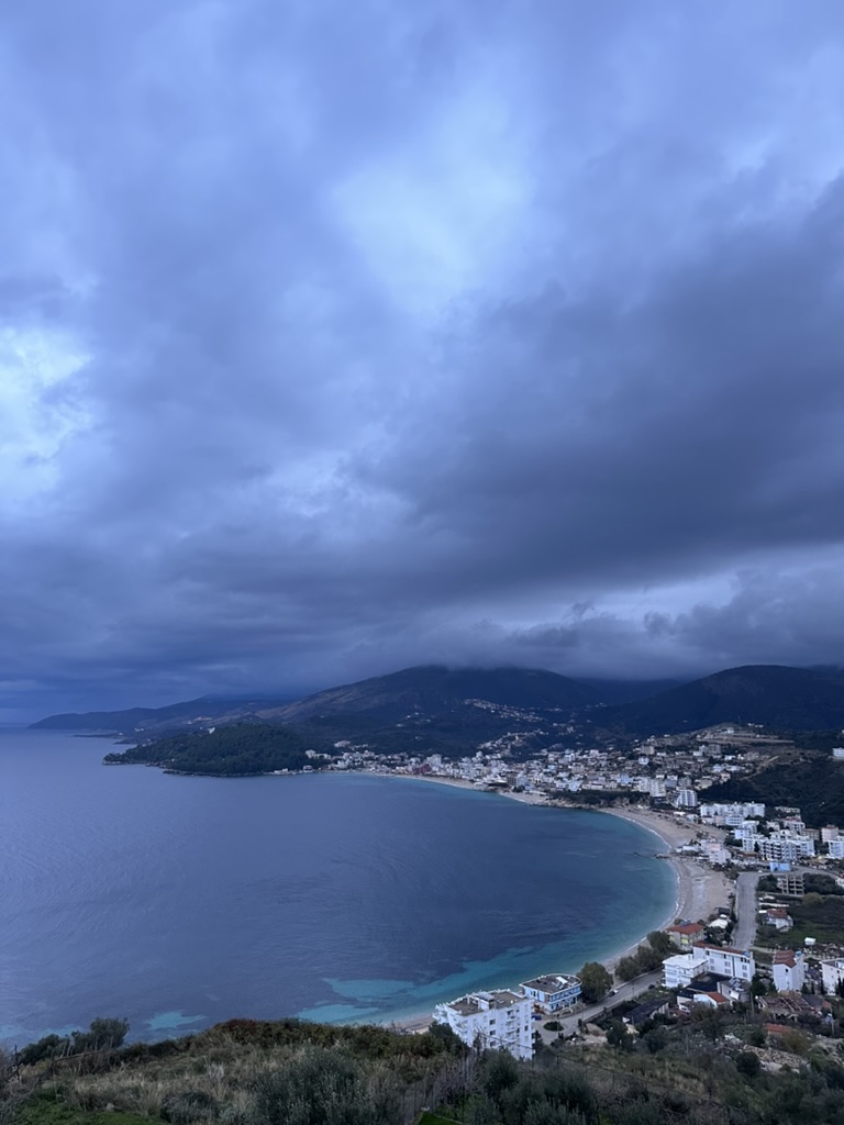 Golden evening light on the Himara coastline during September shoulder season