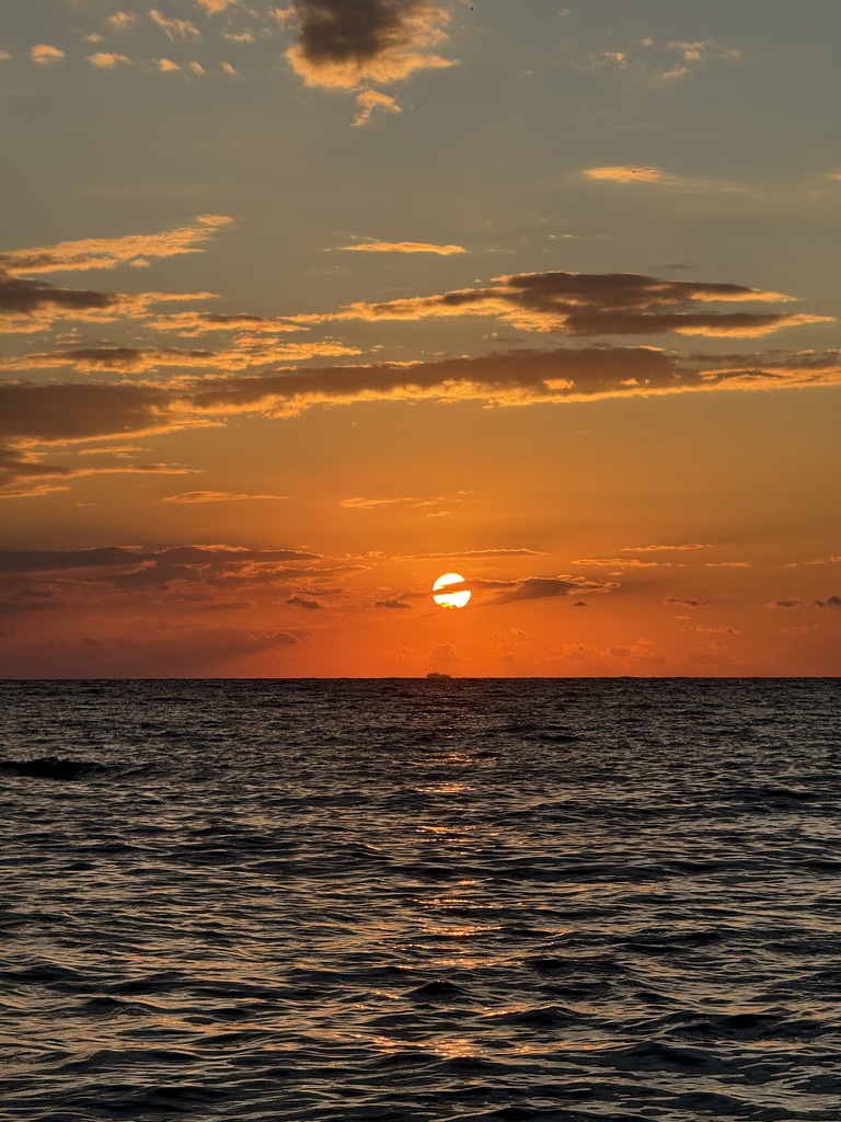 Turquoise waters and rocky coastline at Jale Beach during peak summer