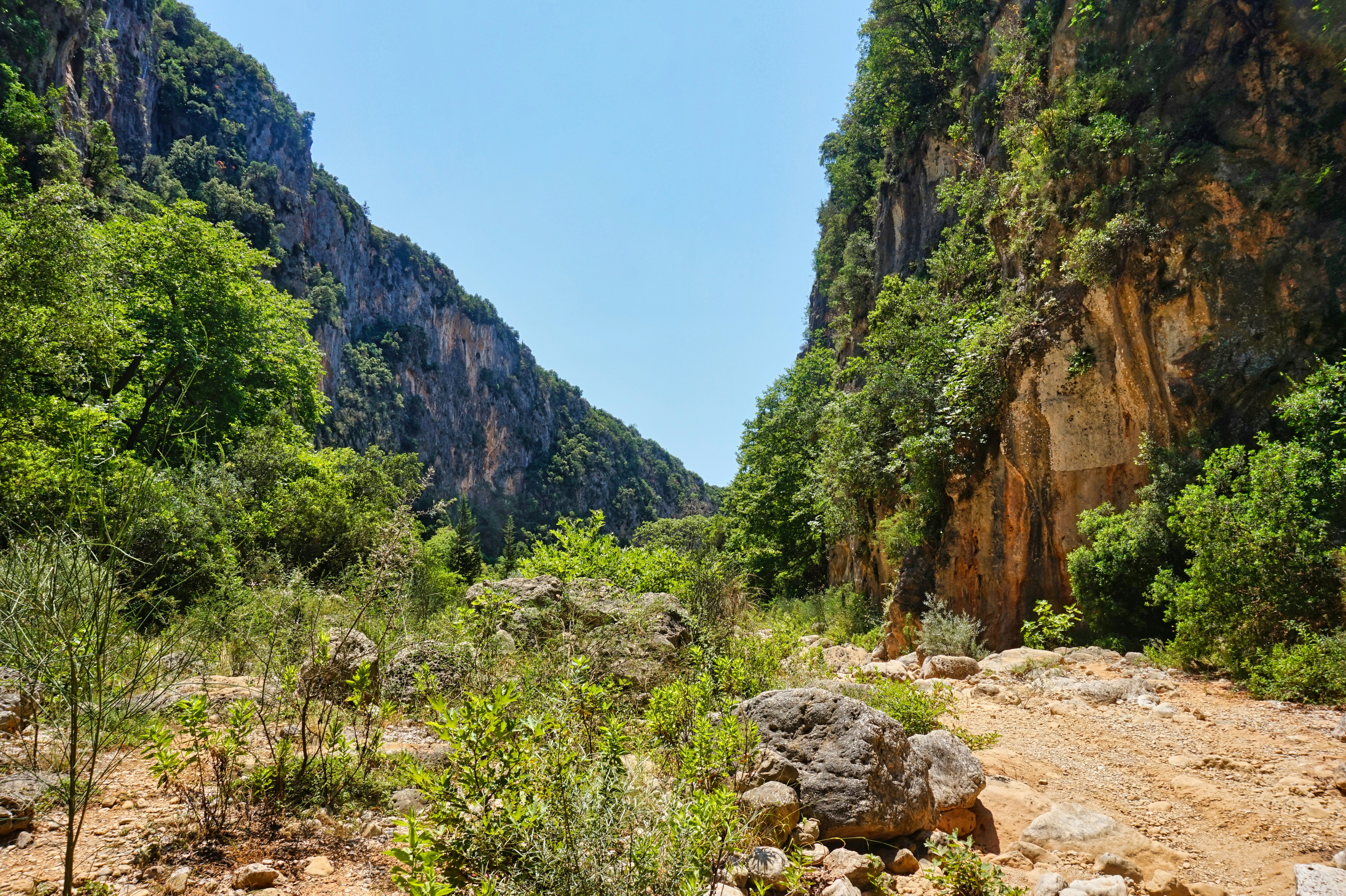 Panoramic aerial view of Porto Palermo Bay along the SH8 coastal highway from Vlora to Himara