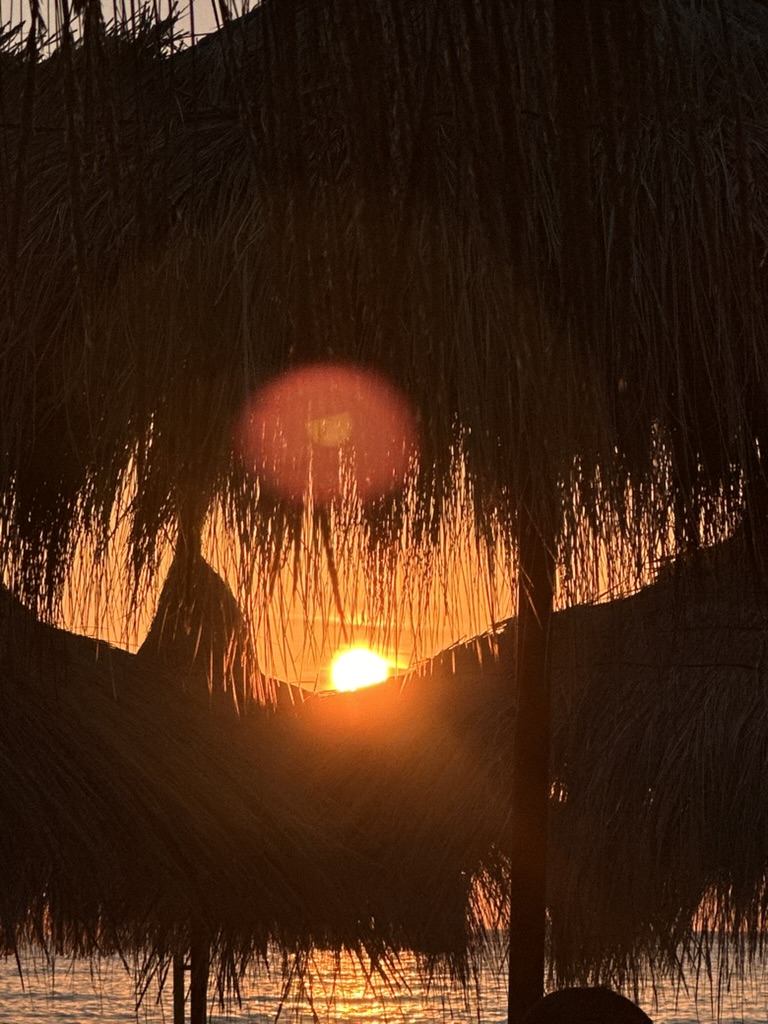 Sunset umbrella silhouette — albania fake listings accommodation