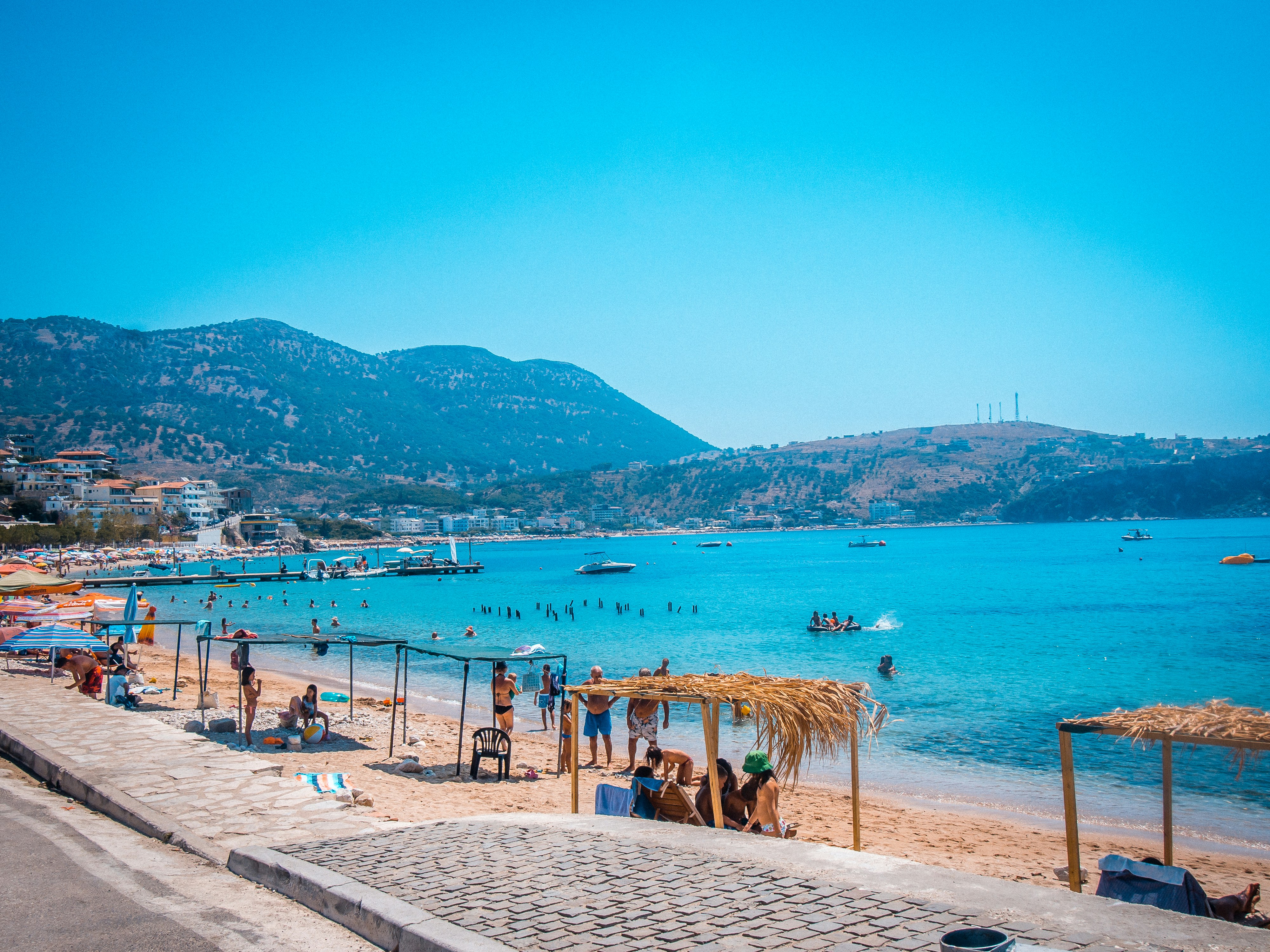 Spile Beach promenade view with turquoise waters in Himara