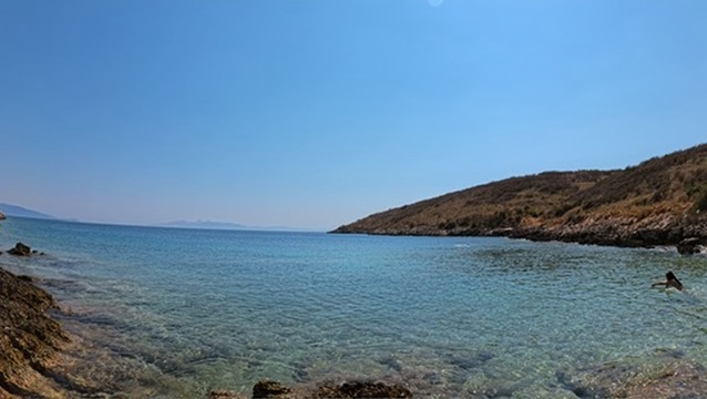 Boat wake on the Ionian Sea at sunset along the Himara to Saranda ferry route