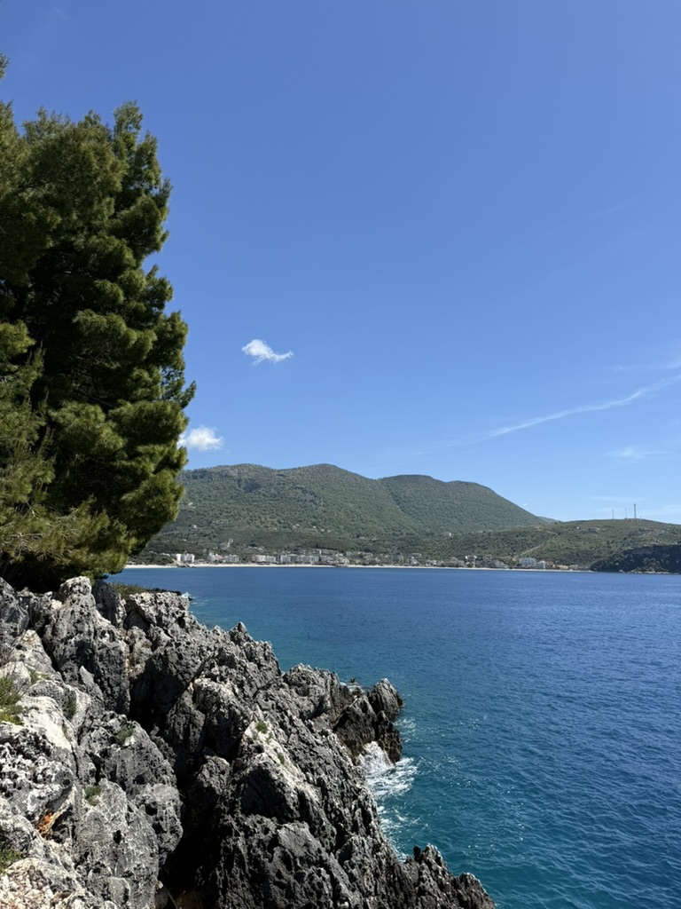 Sunset view along a coastal road on the Albanian Riviera heading toward the Kakavia border
