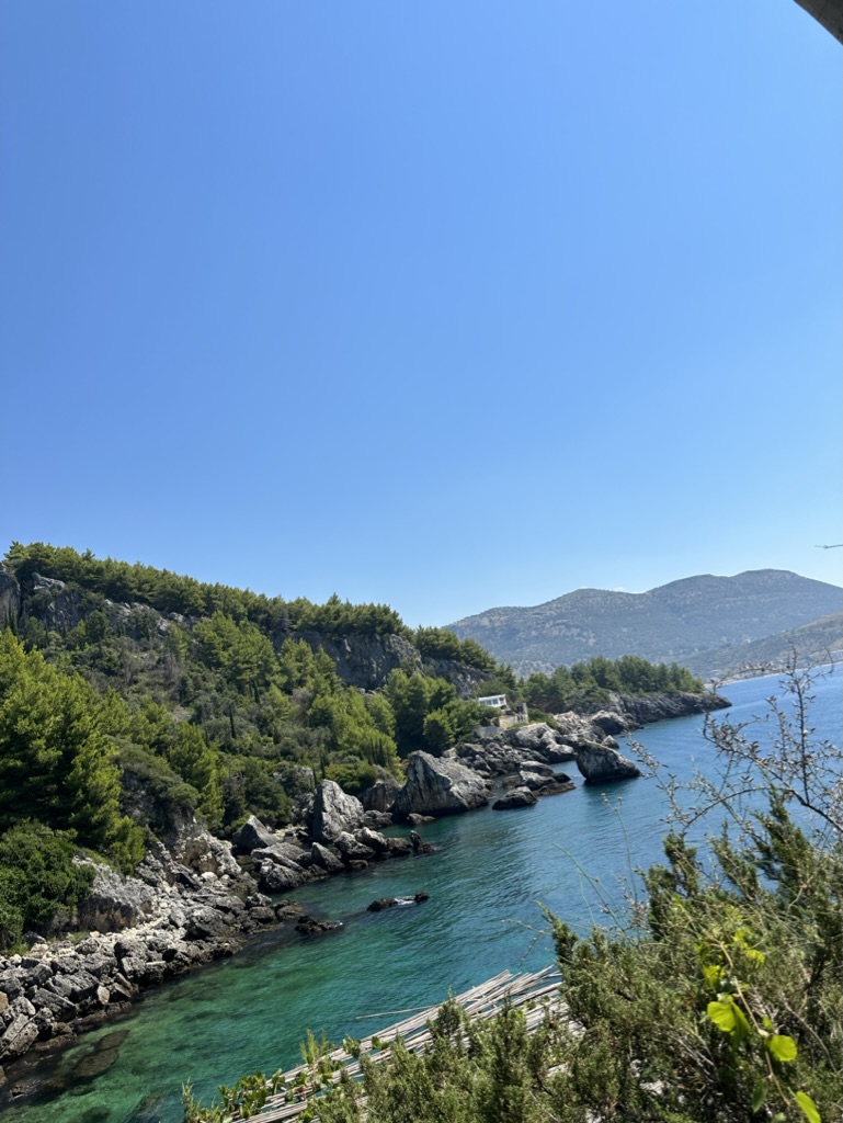 Aerial view of Himara bay and Spile peninsula for long-stay rental planning
