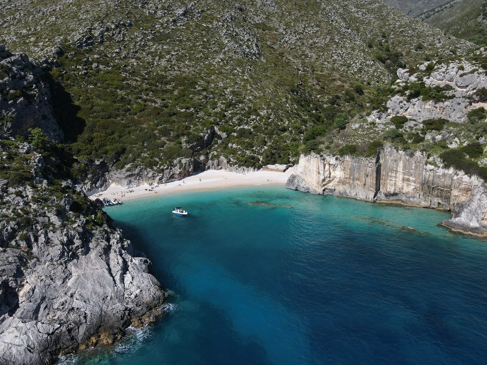Aerial of the wild Karaburun cliffs facing the Adriatic, the coastline you sail past on the way to Sazan Island, Albania