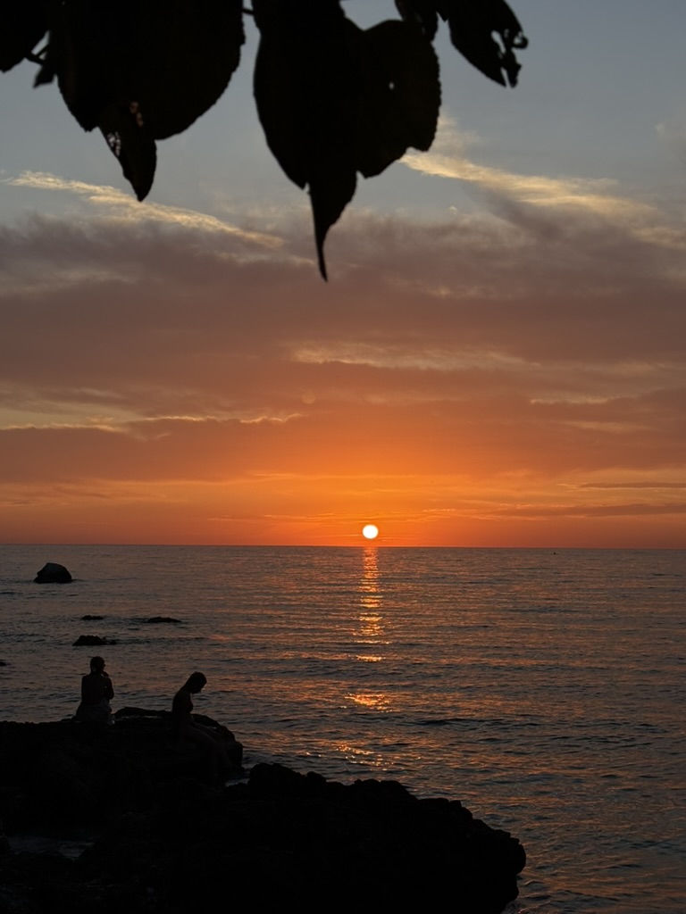 Sunset view along the Himara coastline from a coastal walking path near Spile Beach