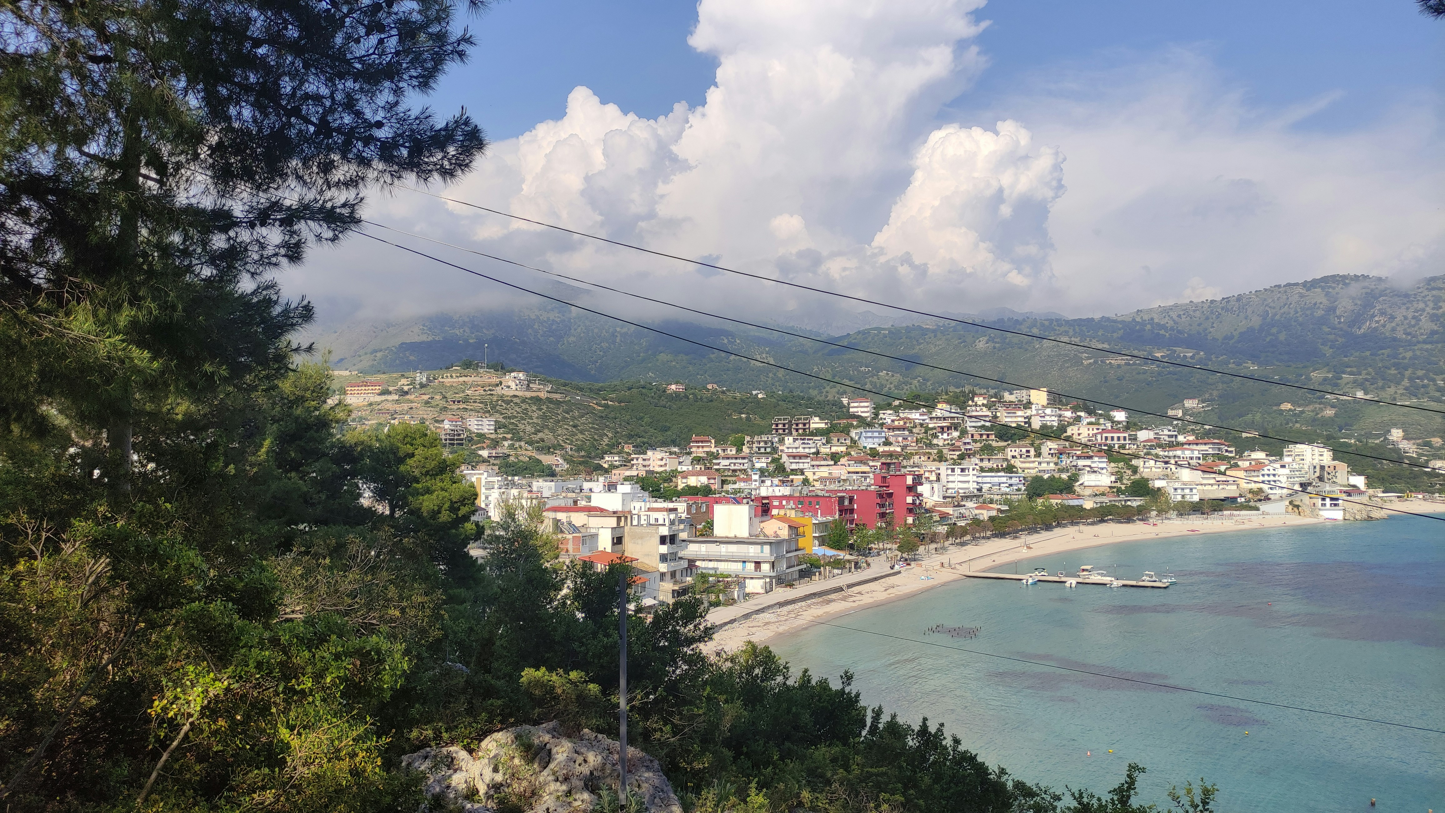 Spile Beach in Himara with the Old Town rising above the waterfront