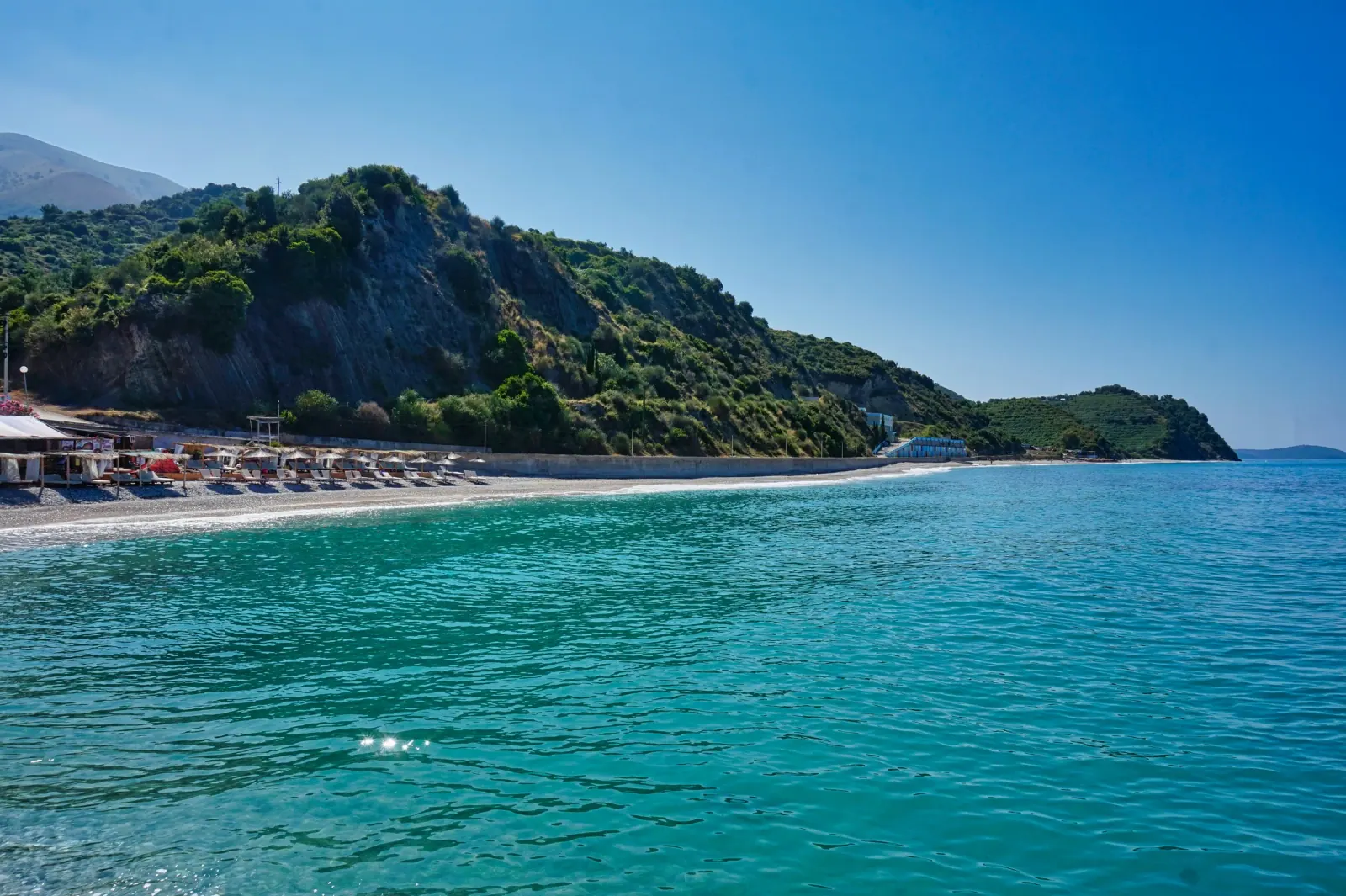 Quiet southern Albanian Riviera beach at sunset, evocative of Krorëz