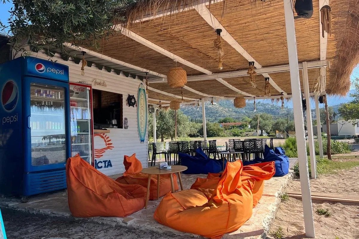 Rustic seating at Invicta Beach Bar near Livadh Beach