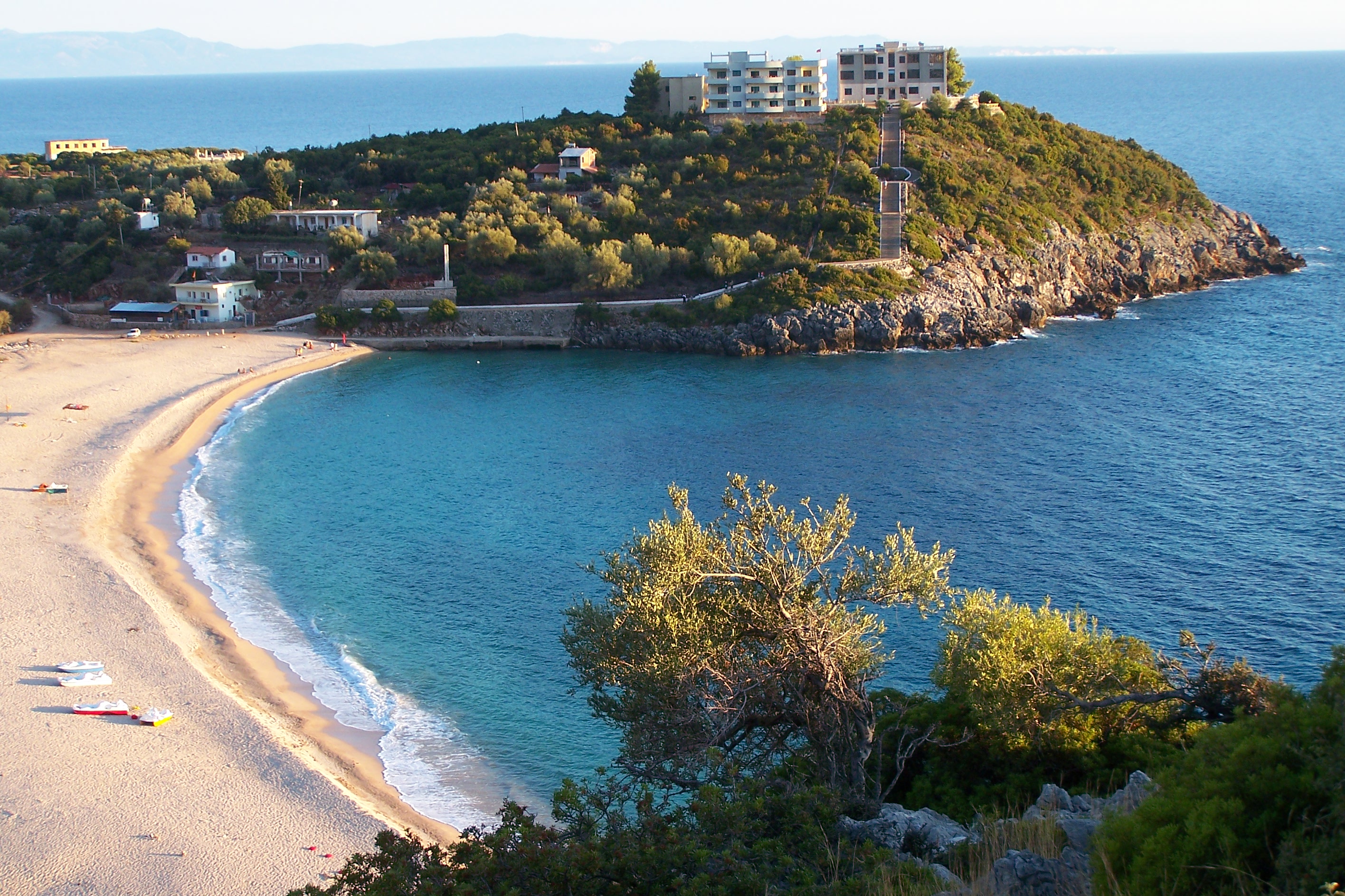 Jale Beach with turquoise waters and pebble shoreline 12 km north of Himara
