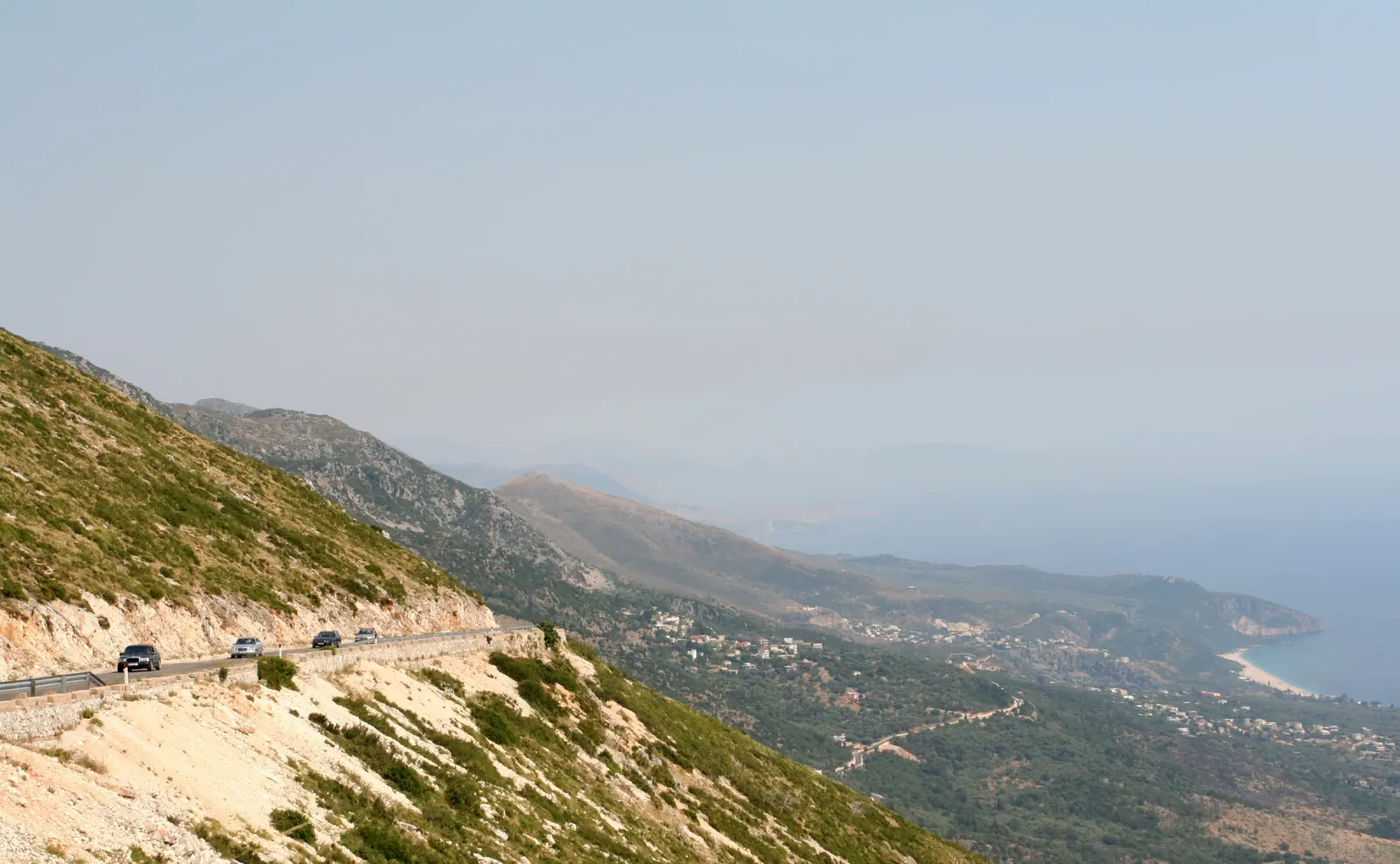 The winding coastal road from Llogara Pass descending toward Dhermi and the Albanian Riviera