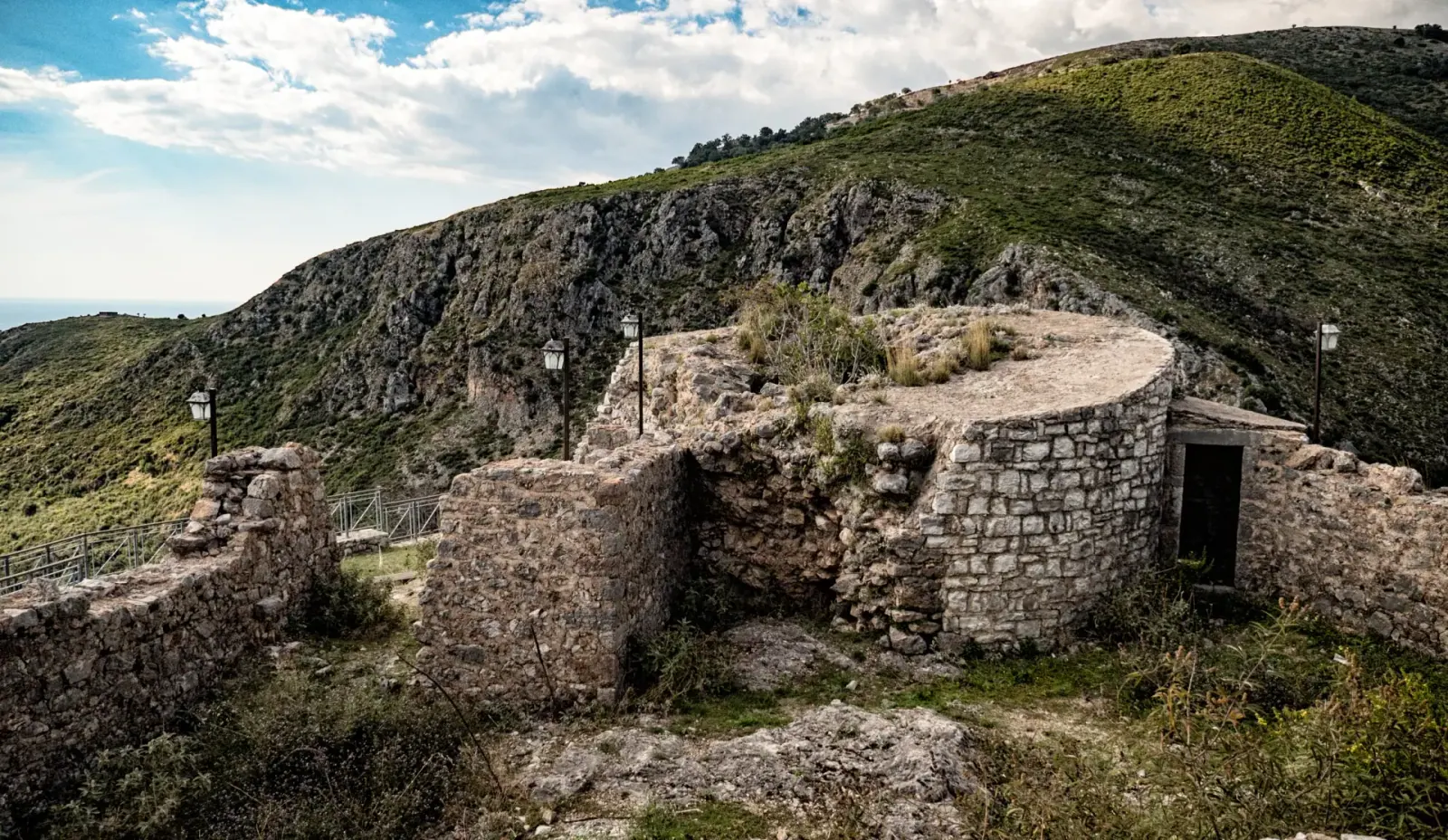 Stone walls and Byzantine church ruins at Himara Castle overlooking the coast