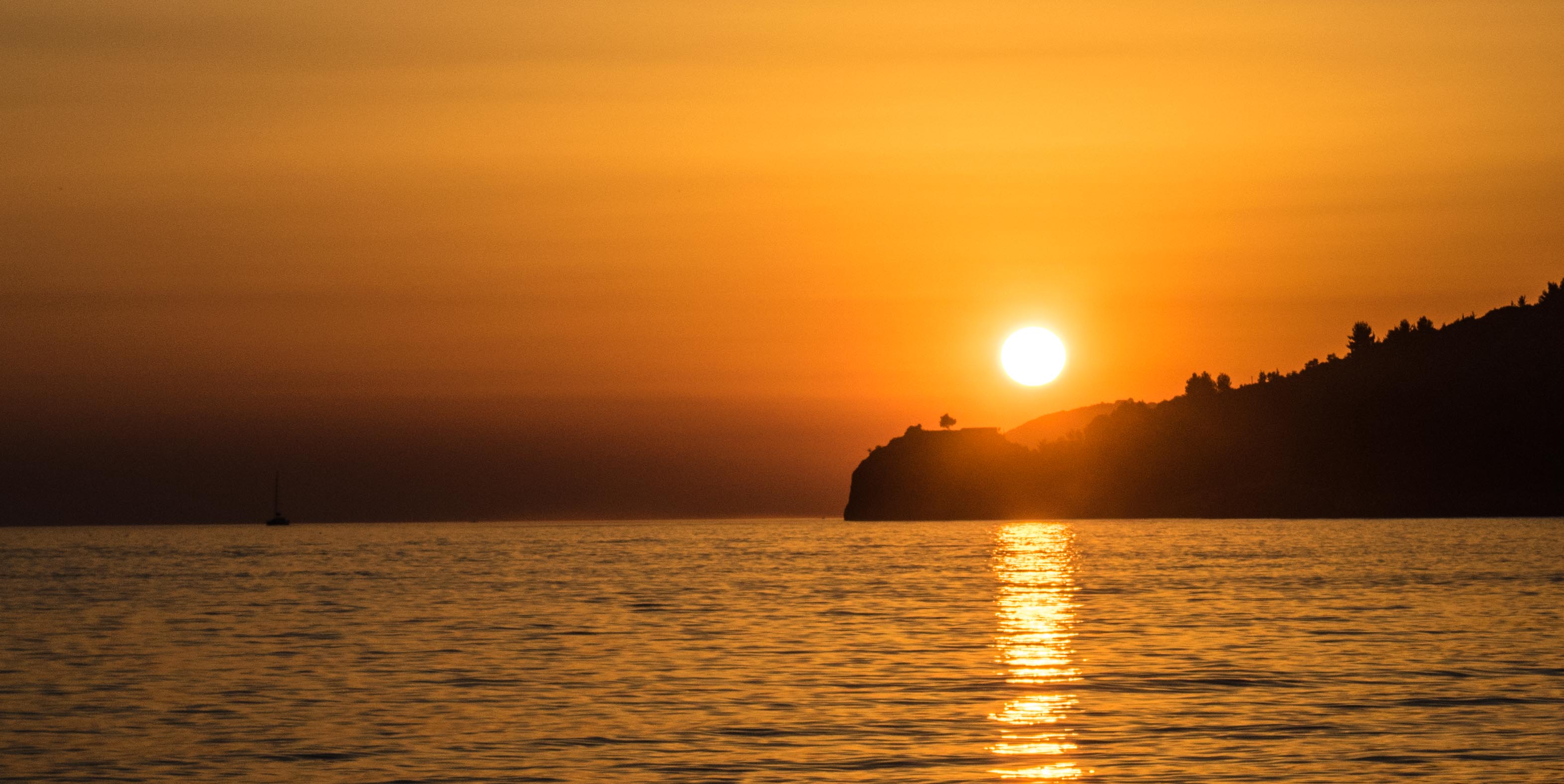 Potami Beach with turquoise waters and surrounding hills south of Himara