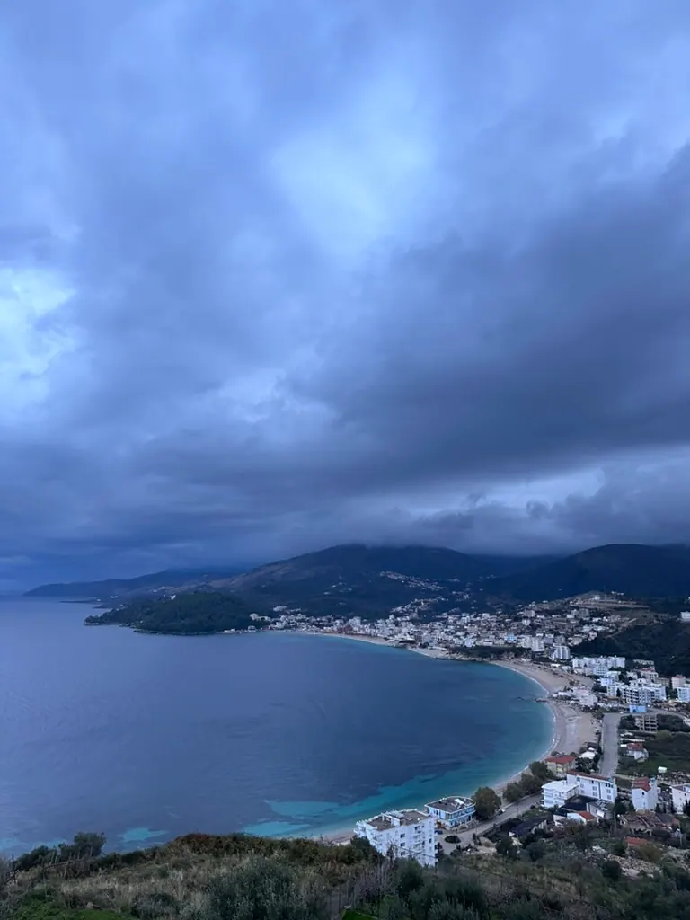 Golden evening light on the Himara coastline during September shoulder season