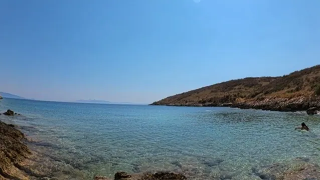 Boat wake on the Ionian Sea at sunset along the Himara to Saranda ferry route